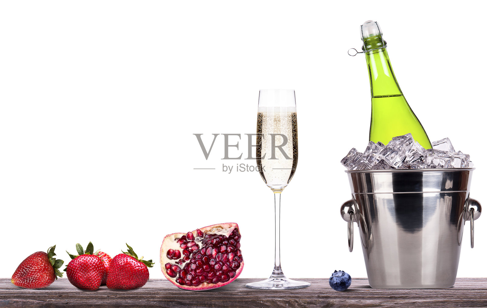 夏日水果和冰桶配香槟照片摄影图片