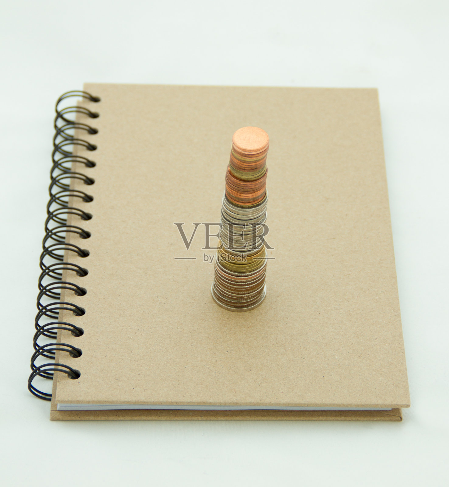 硬币和笔记本照片摄影图片