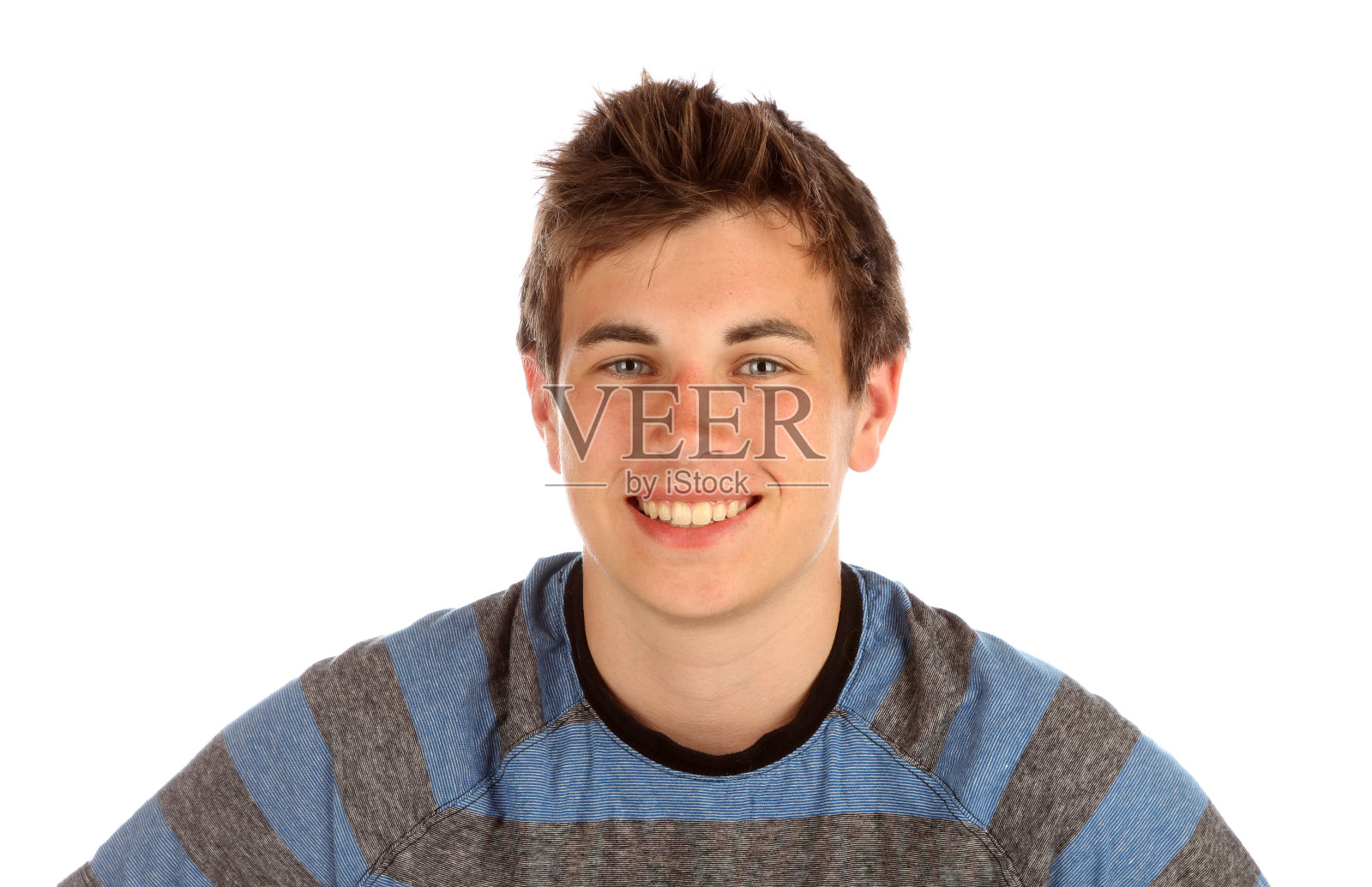 一个十几岁的男孩在照相。照片摄影图片