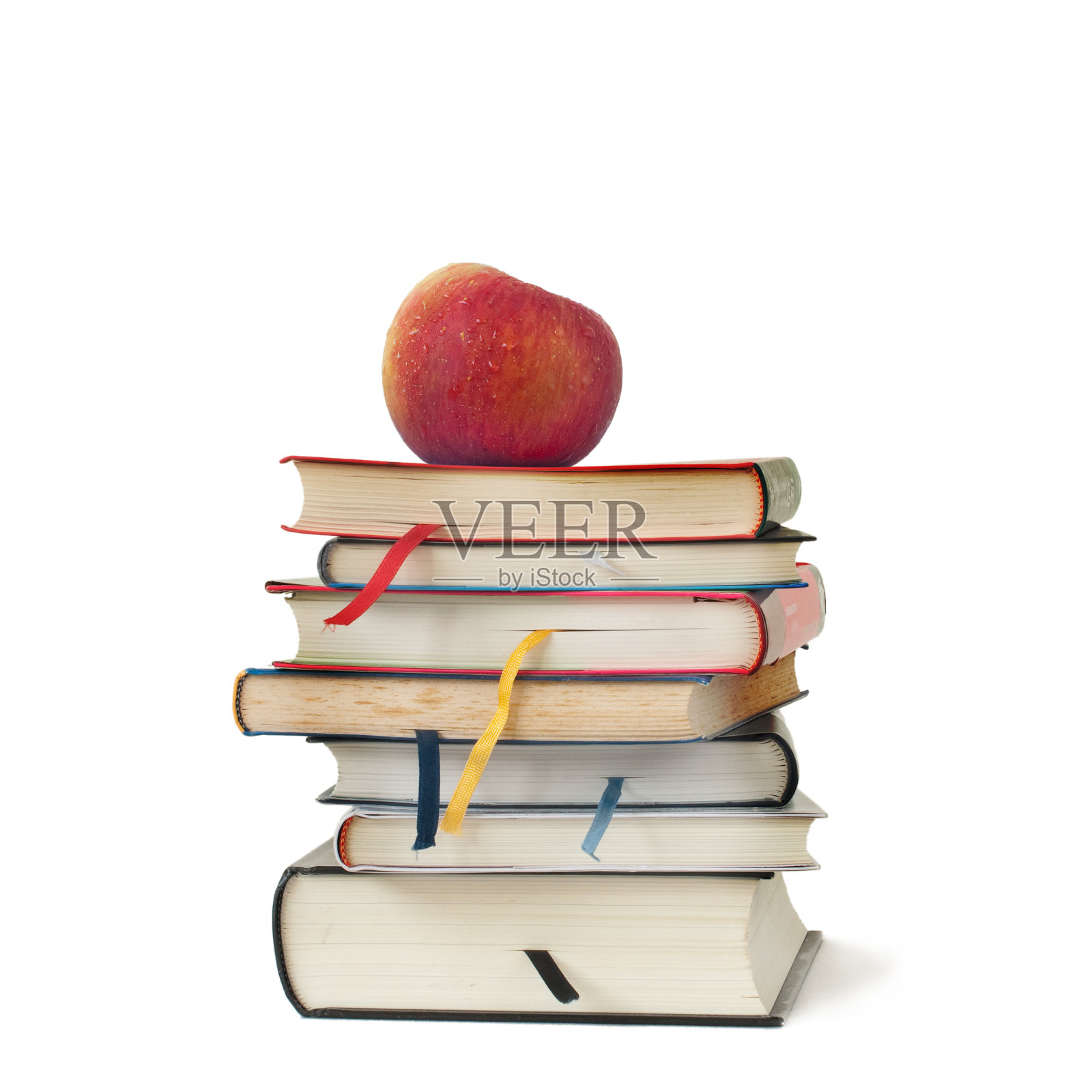 苹果在书的上面照片摄影图片