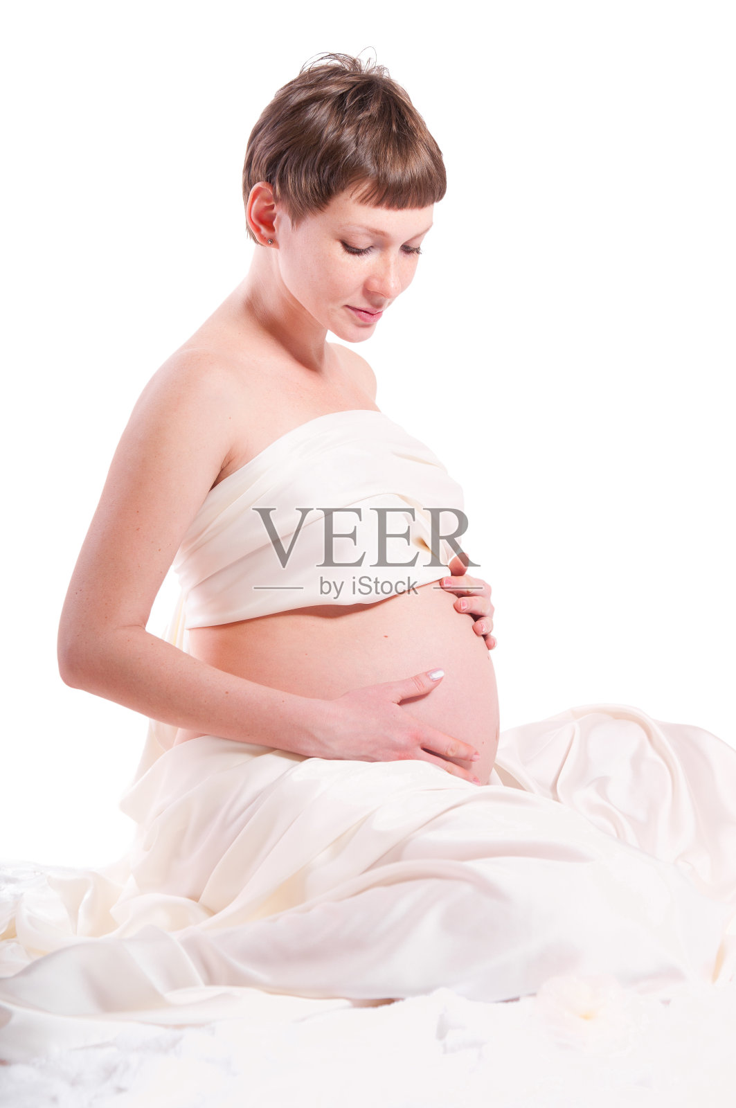 一个美丽的孕妇肖像在白色照片摄影图片