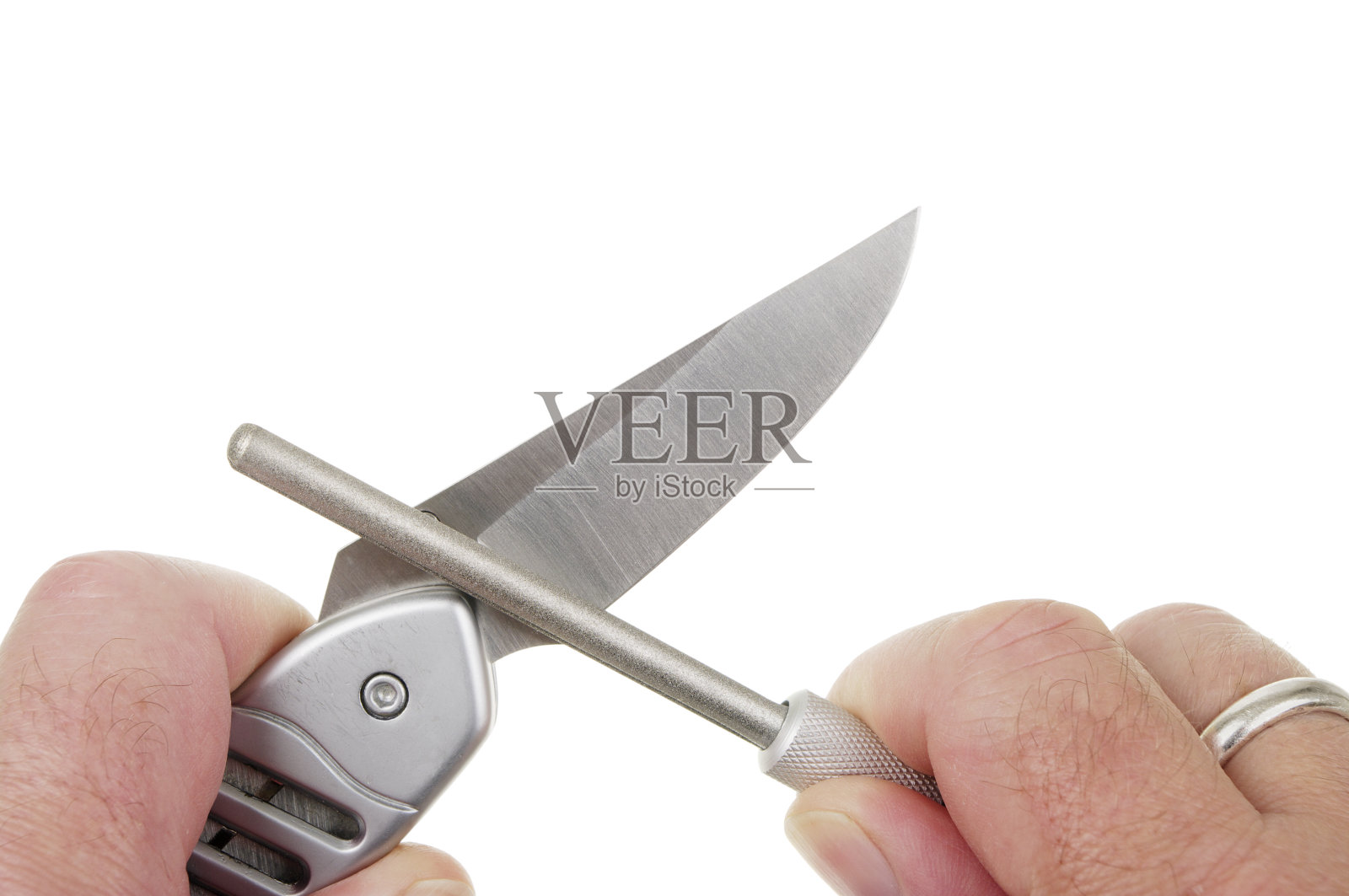 锁刀正在用钻石磨刀磨砺照片摄影图片