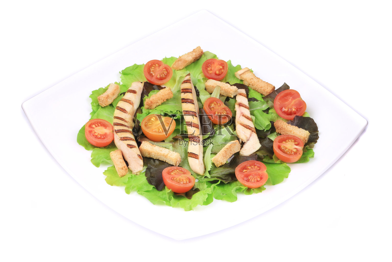 恺撒沙拉用的盛有蔬菜的盘子。照片摄影图片