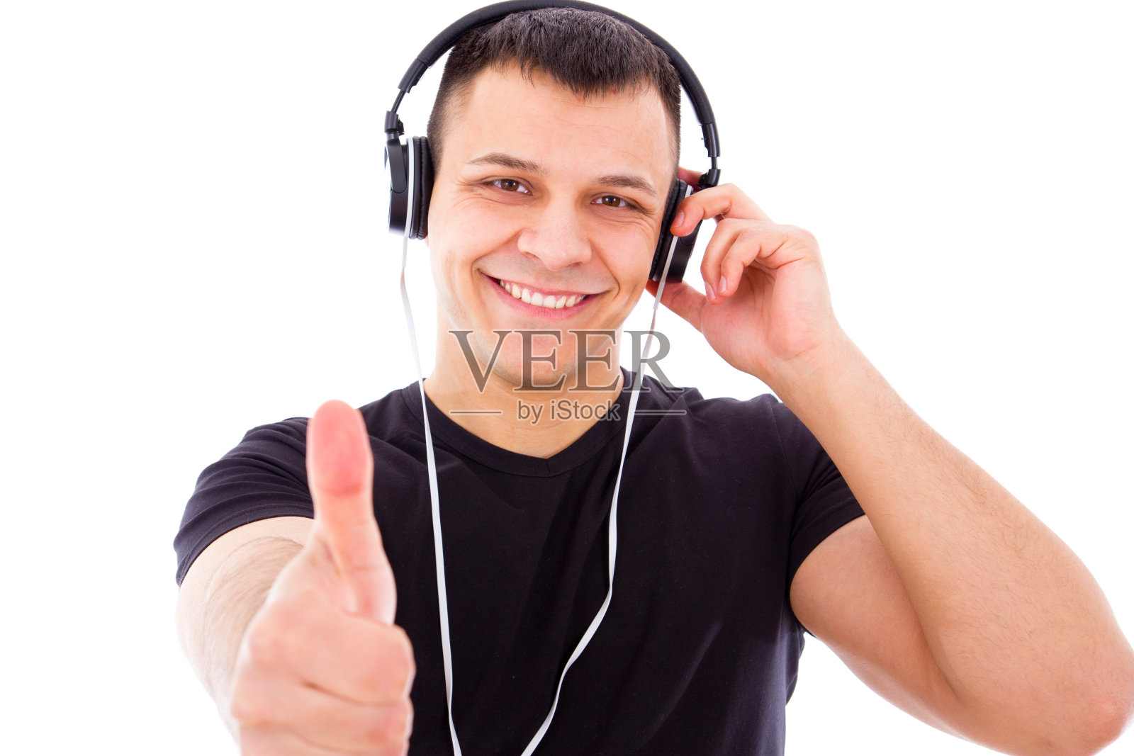 戴着耳机微笑的DJ竖起大拇指照片摄影图片