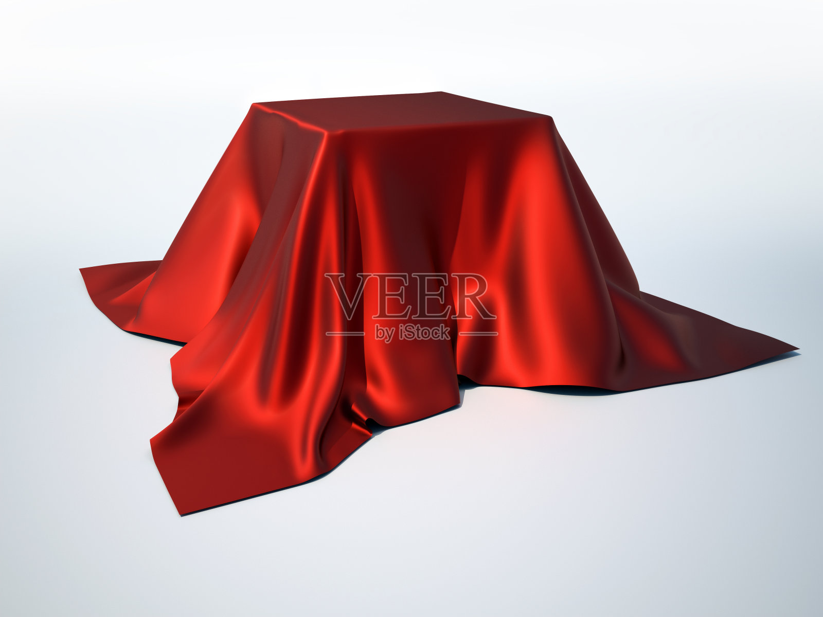 铺在方形物体上的红色光滑的桌布照片摄影图片