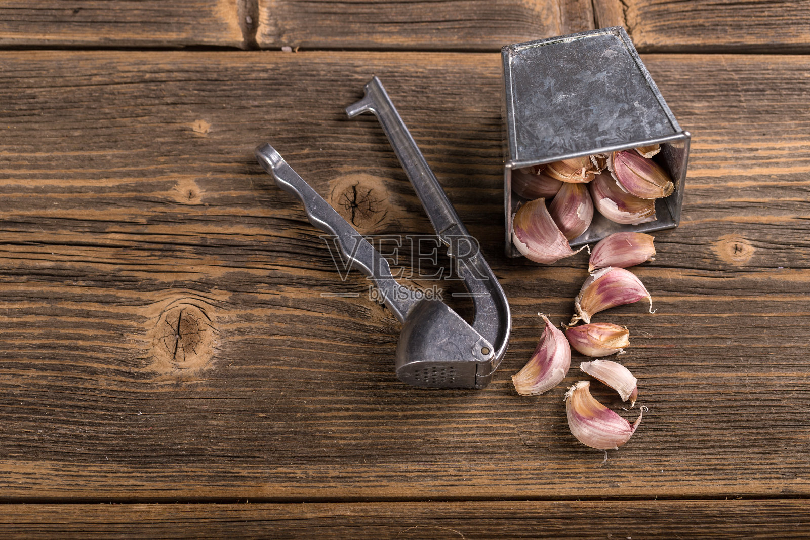 大蒜及压蒜机照片摄影图片