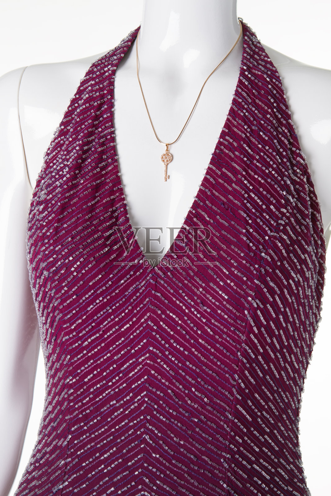 漂亮的肩带金钥匙。照片摄影图片