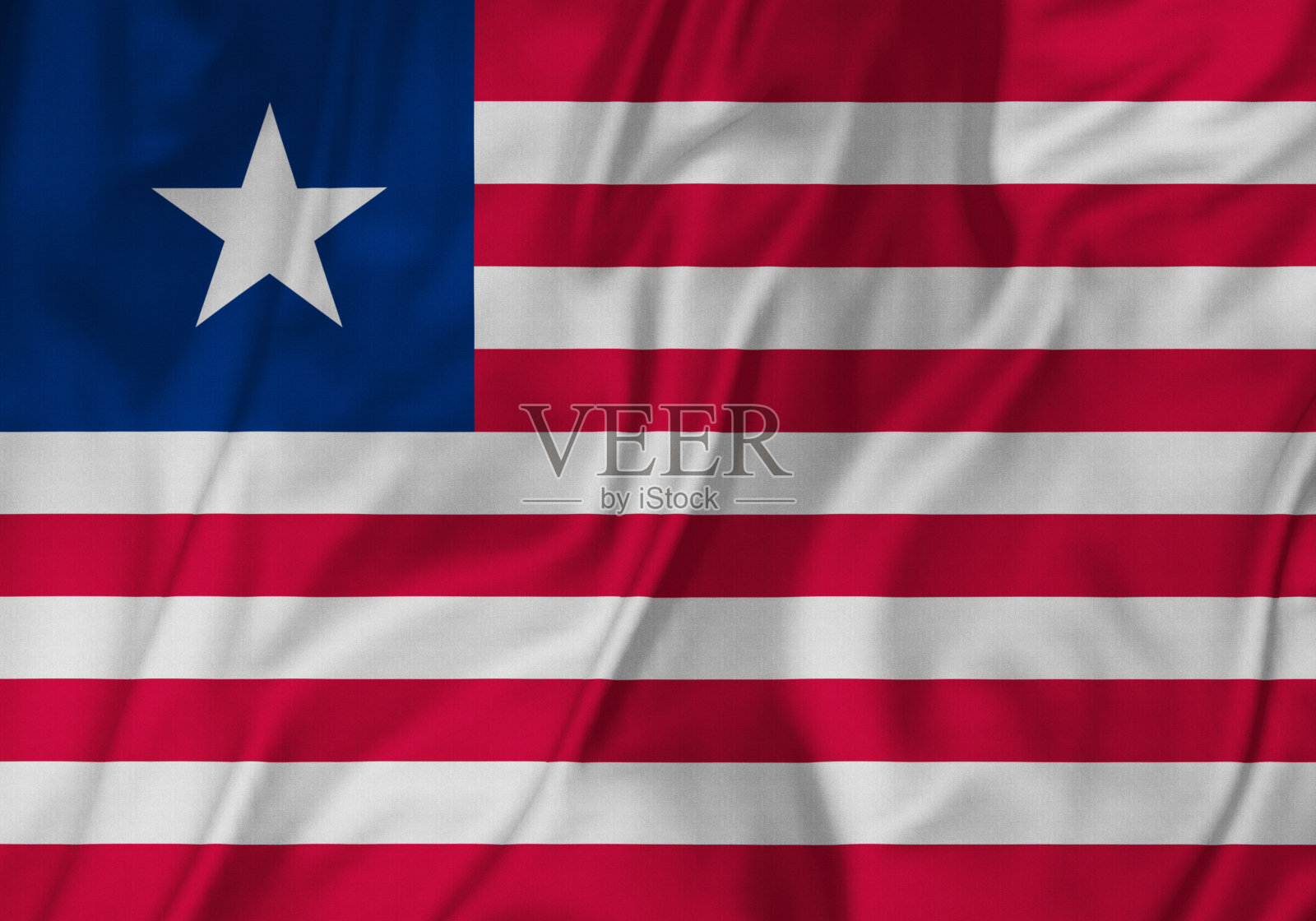 皱褶利比里亚旗的特写,利比里亚旗在风中飘扬照片摄影图片