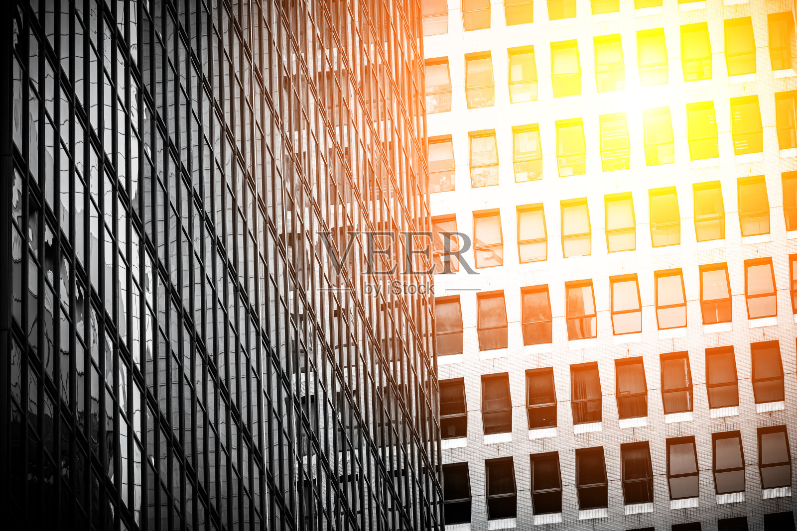 右下角有阳光的现代商业建筑照片摄影图片