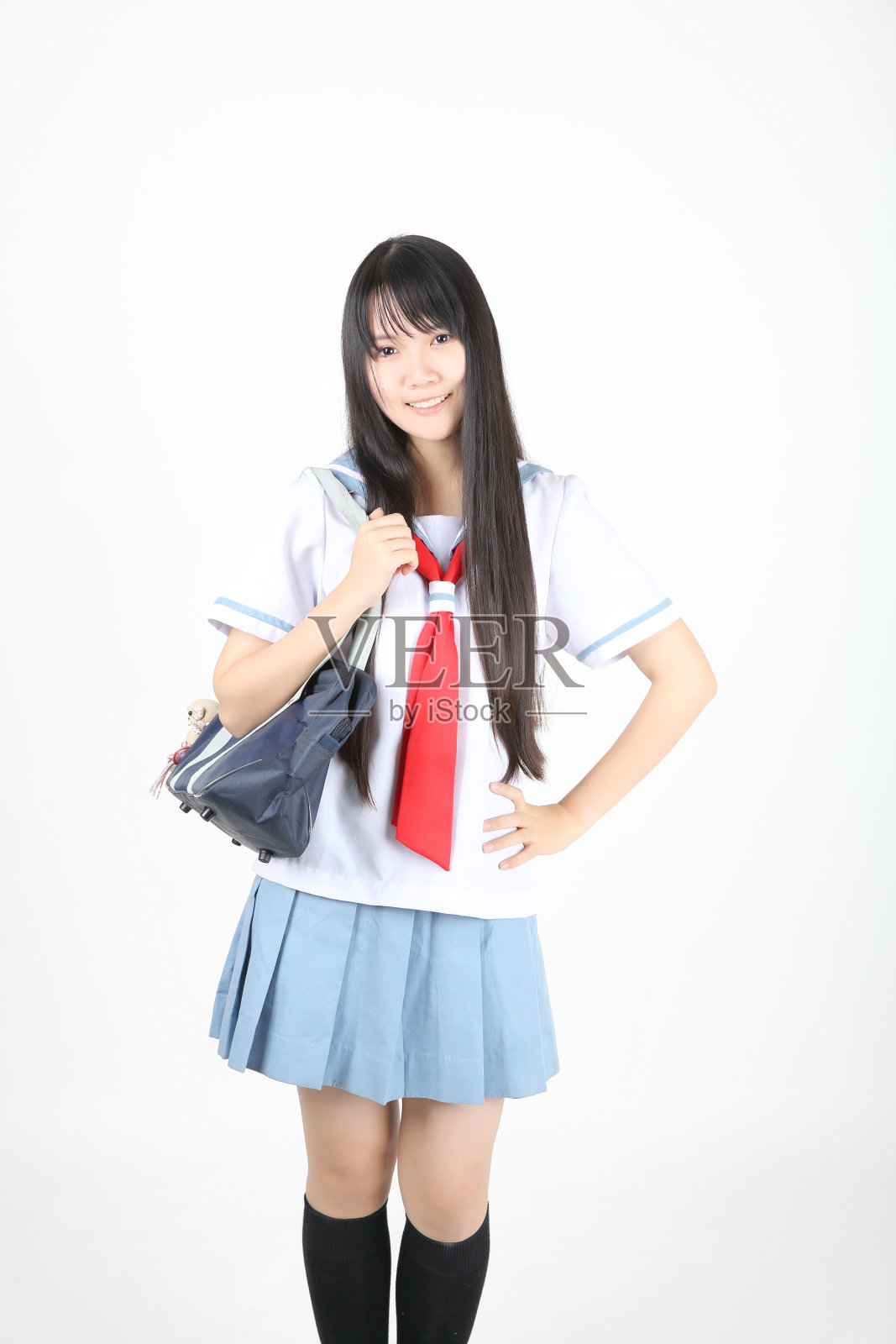 在白人背景下孤立的亚洲女学生照片摄影图片