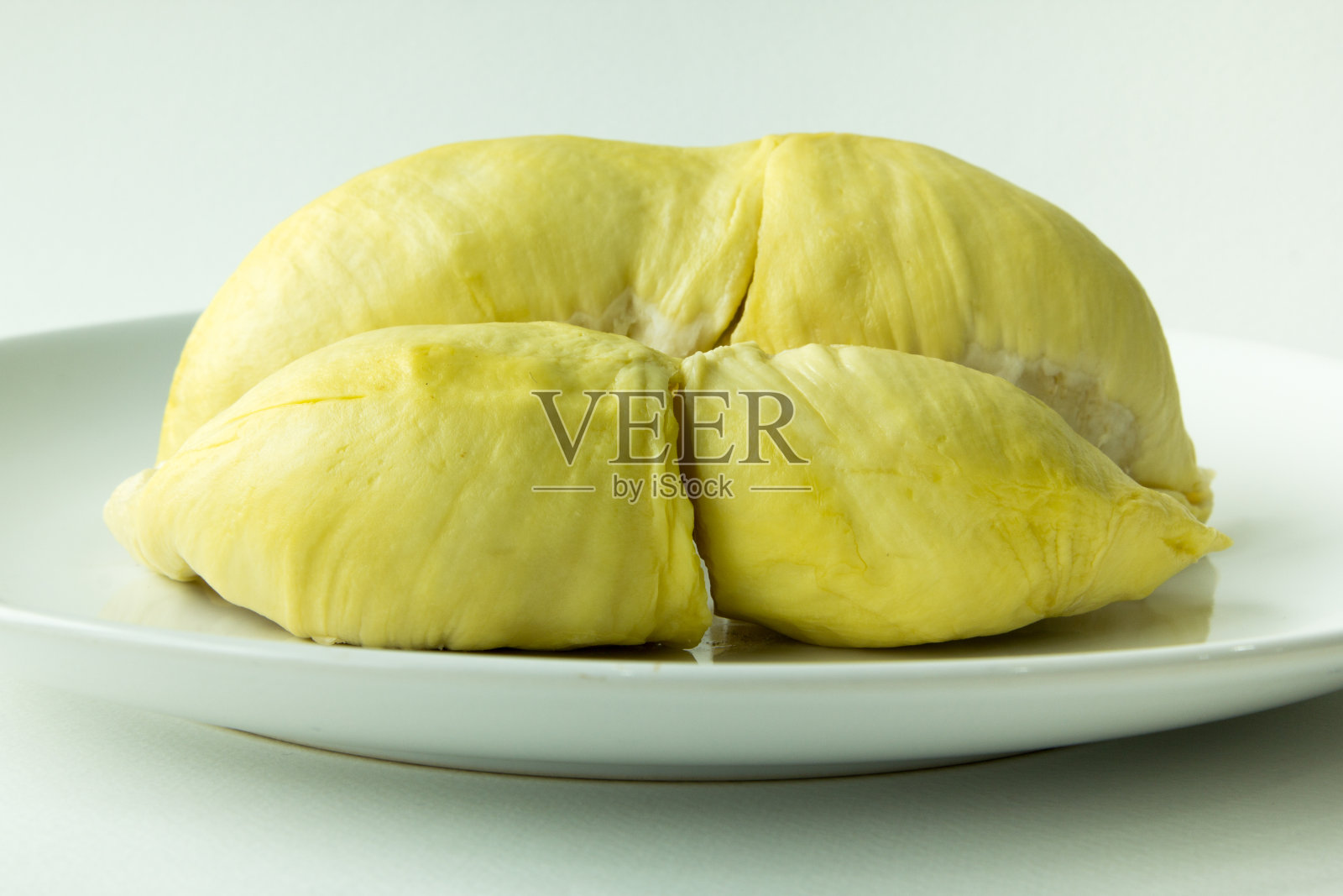 白盘上的榴莲照片摄影图片