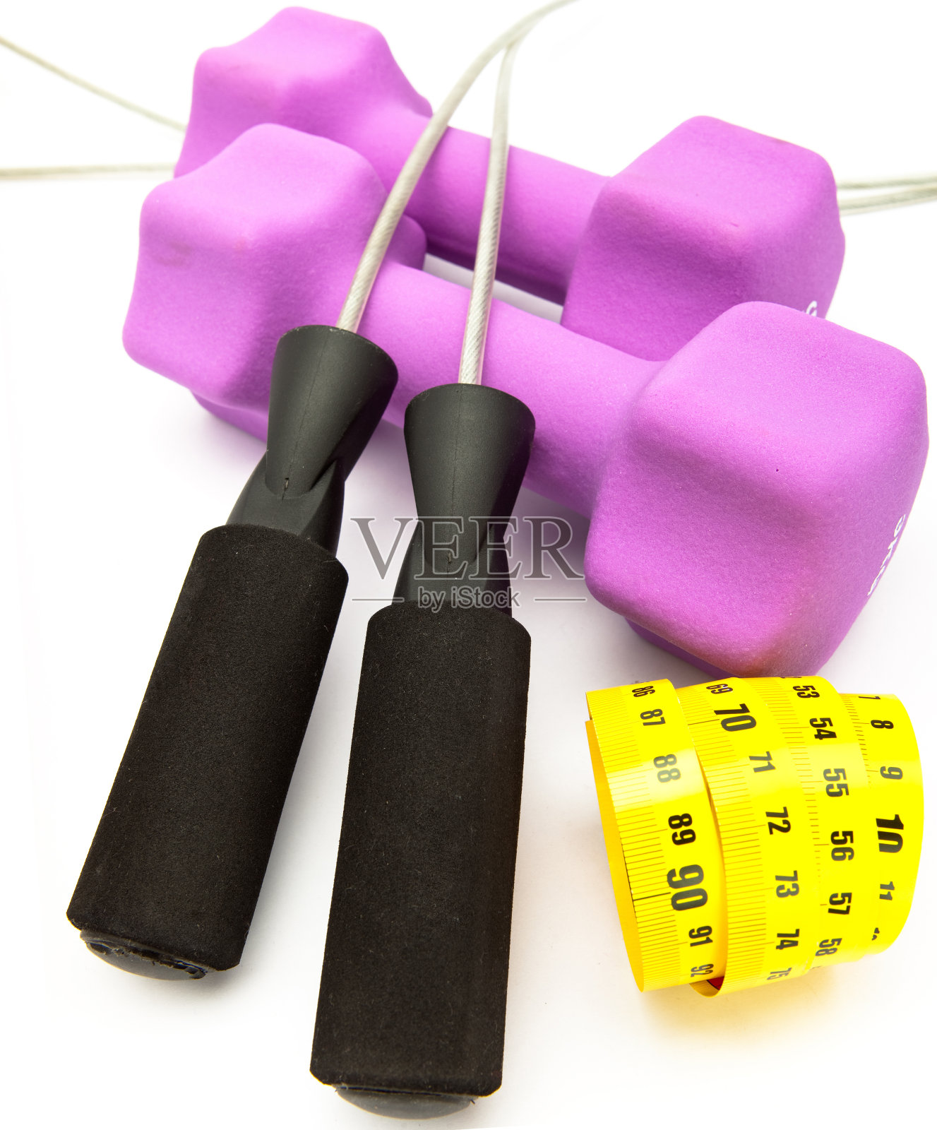 跳绳,卷尺和粉色哑铃照片摄影图片