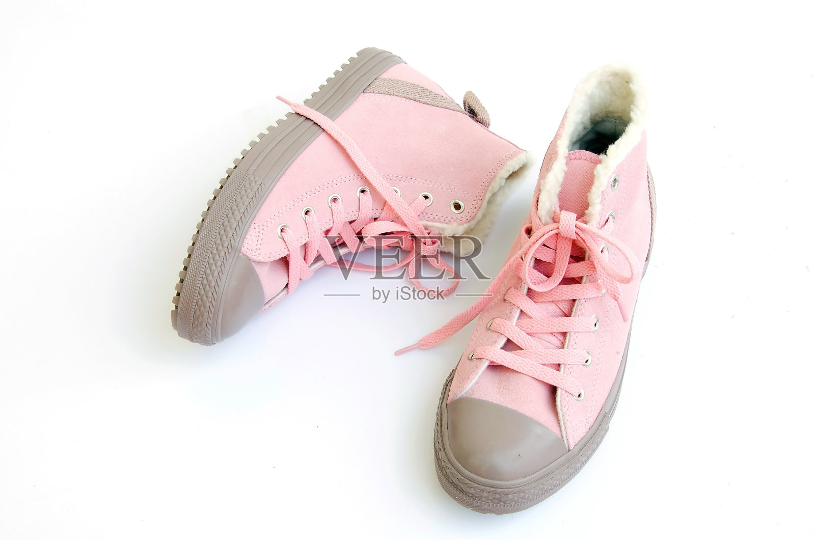 白色背景上的粉色运动鞋照片摄影图片