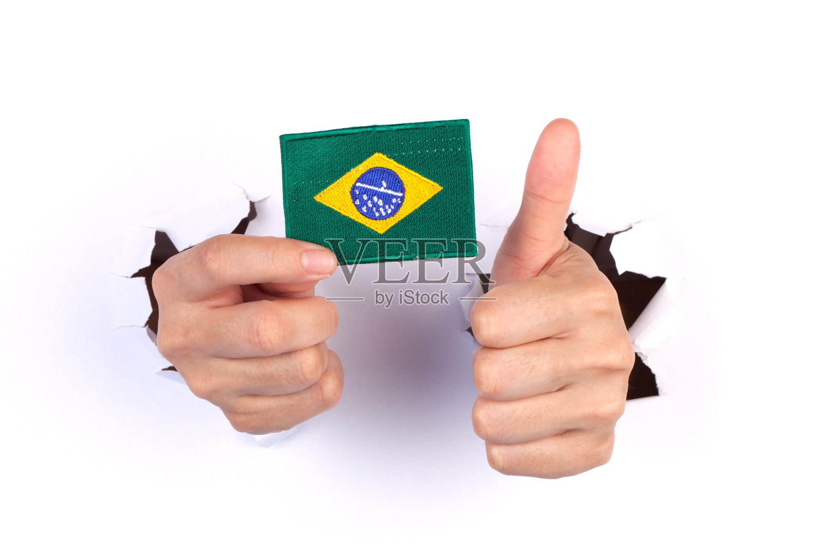 手握巴西国旗的妇女照片摄影图片