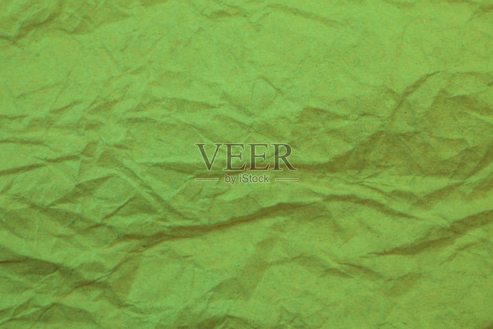 绿色皱纸背景。照片摄影图片