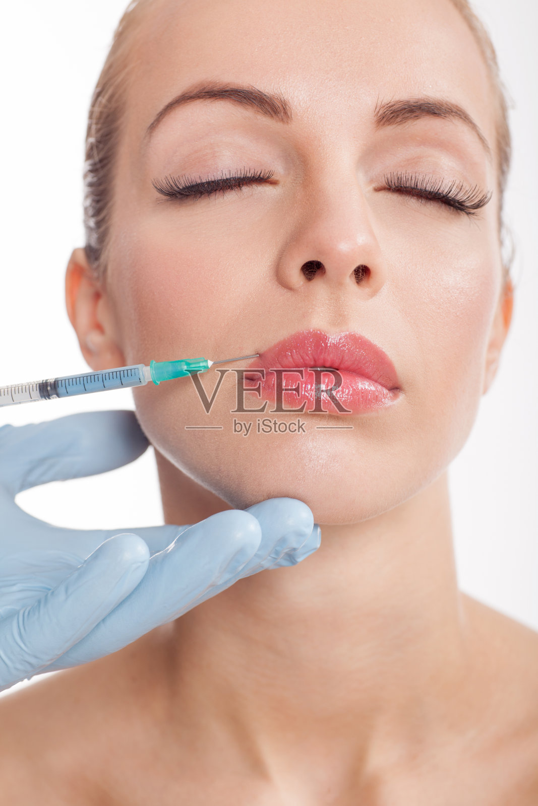 女性嘴唇注射肉毒杆菌照片摄影图片