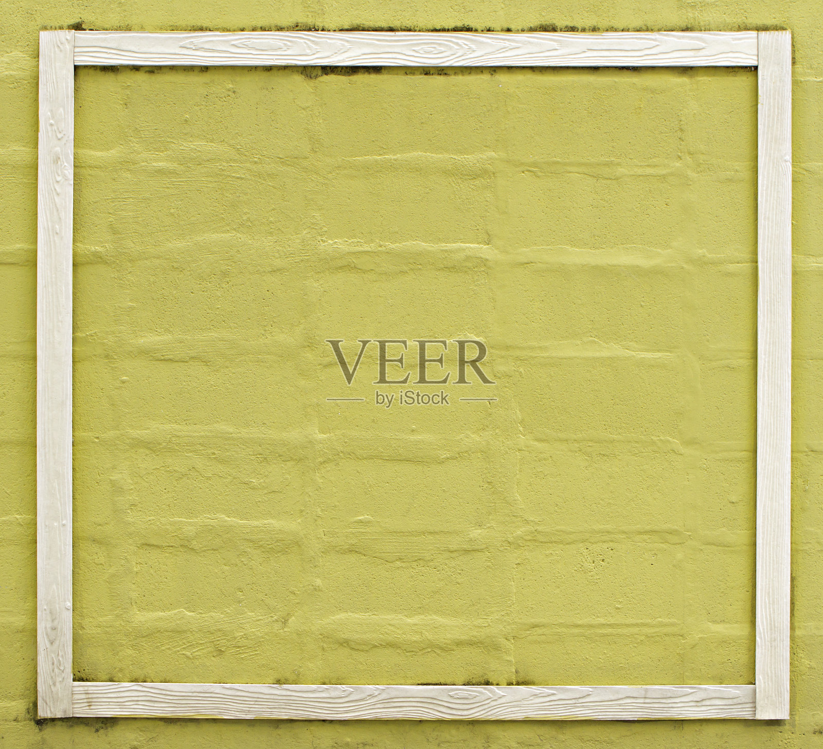 黄色砖墙和白色框架背景。照片摄影图片