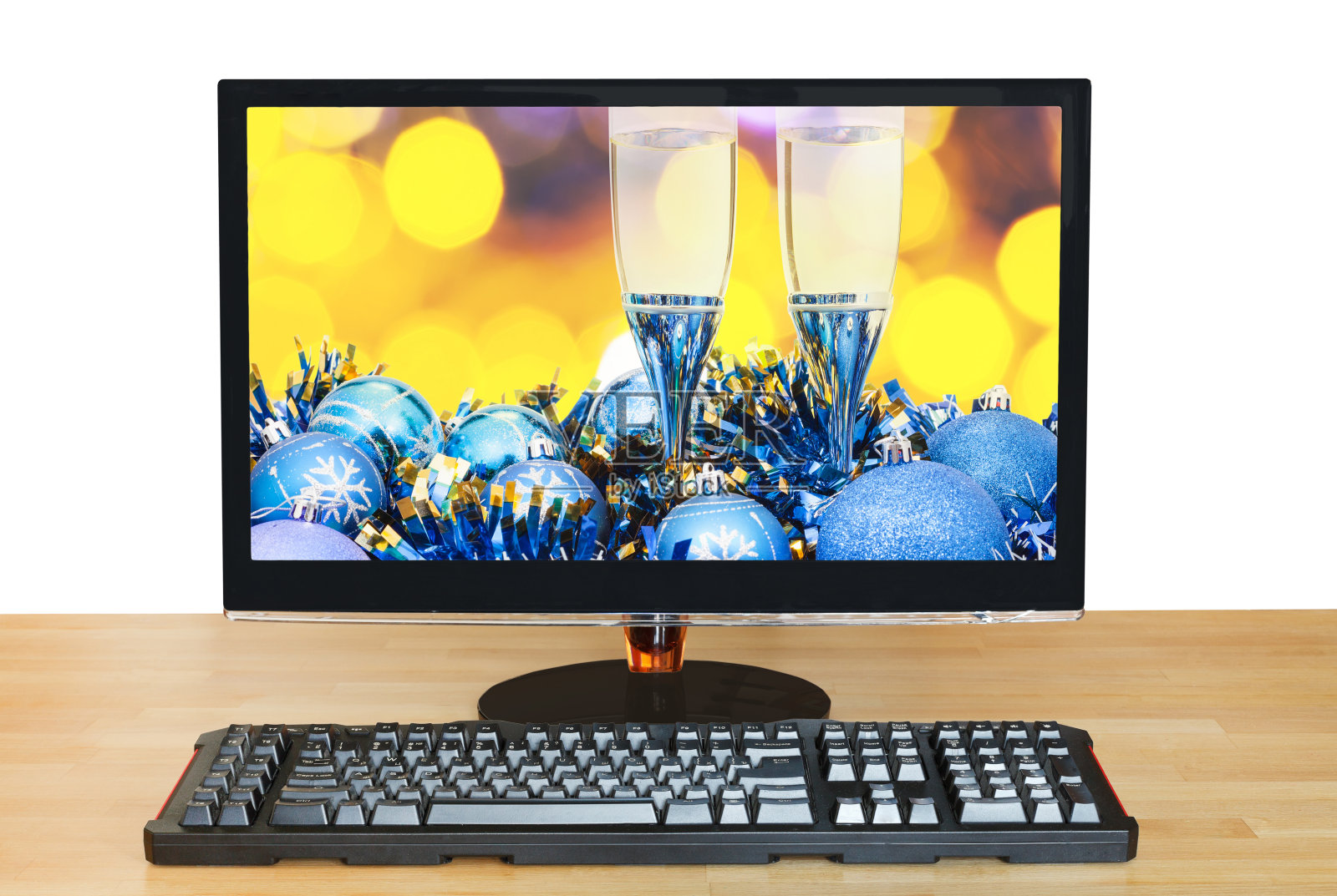 显示器屏幕上的眼镜和蓝色小饰物照片摄影图片