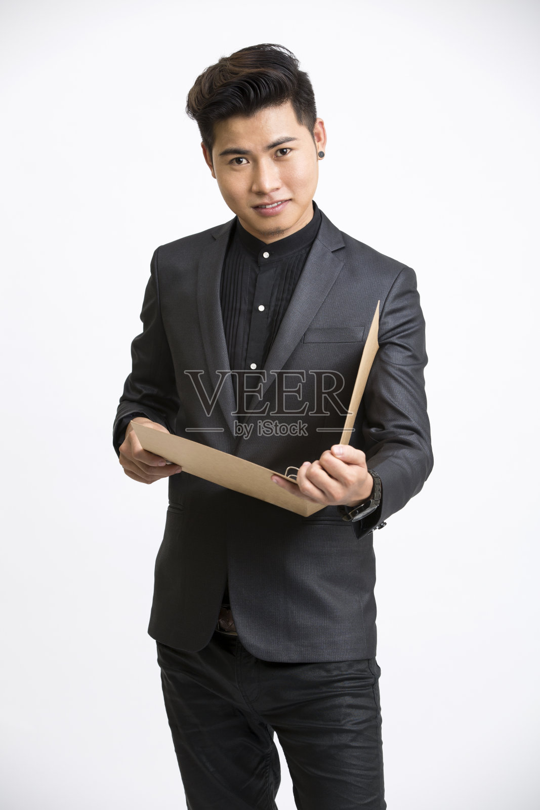 手里拿着文件的商人。照片摄影图片