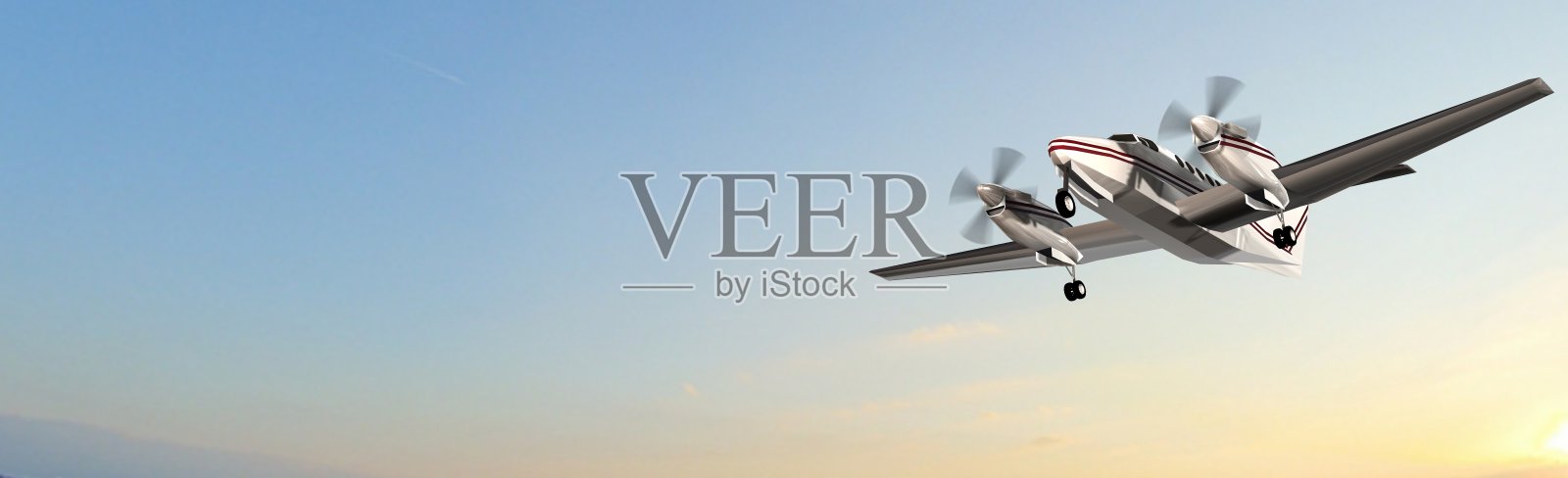 日落时分飞行中的私人螺旋桨飞机照片摄影图片