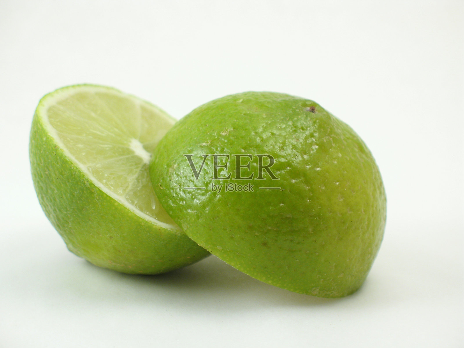 绿色的石灰在白色上分开照片摄影图片