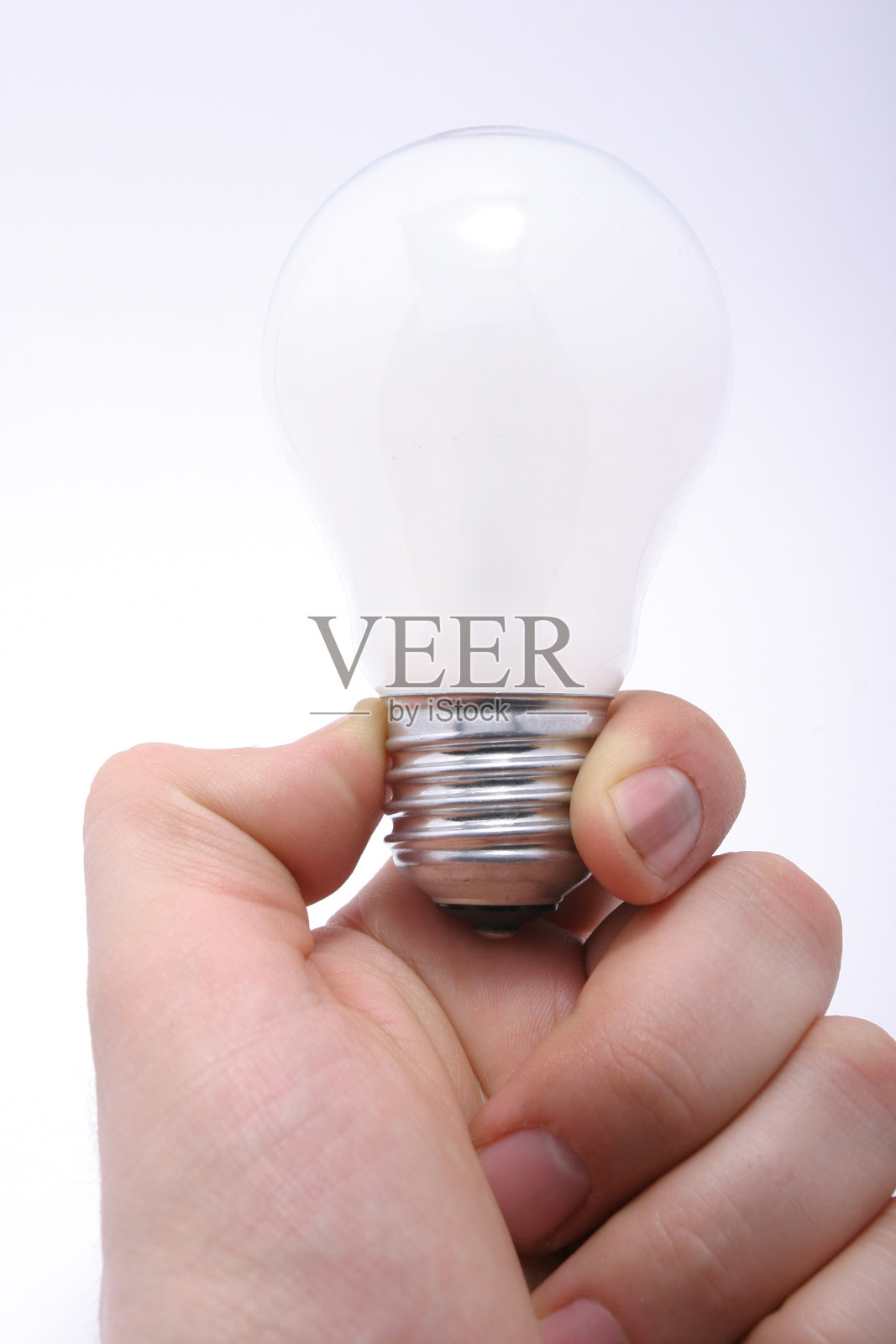 手里拿着灯泡照片摄影图片