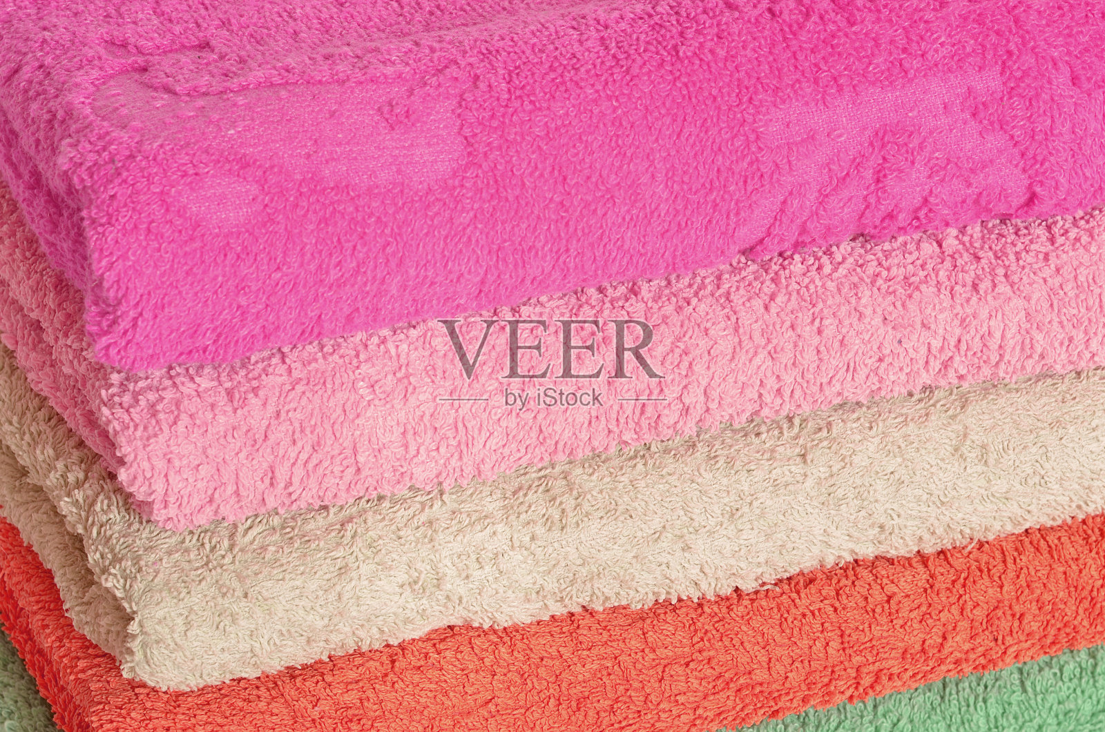 一堆粉色和紫色的毛巾照片摄影图片