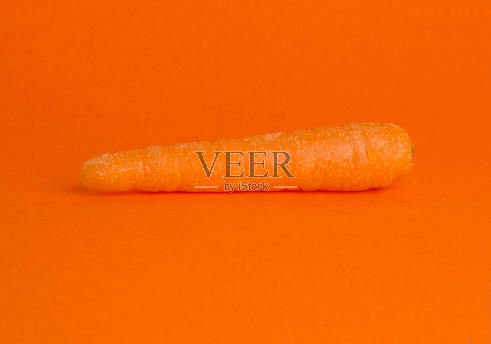 橙色背景的胡萝卜照片摄影图片