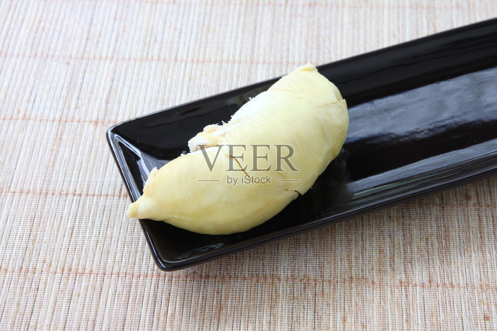 热带水果肉质榴莲。照片摄影图片