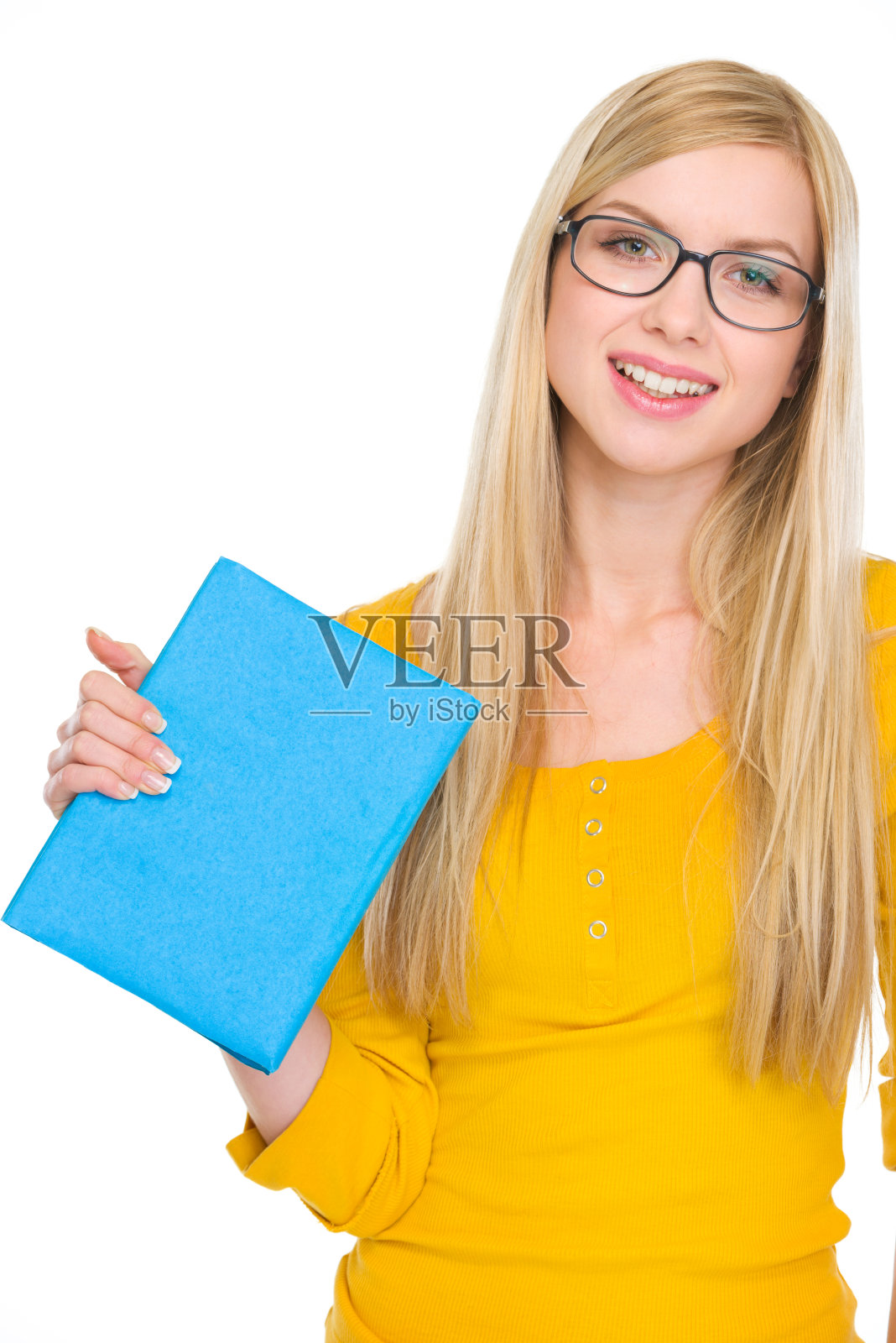 快乐的学生女孩的肖像在眼镜拿着书照片摄影图片