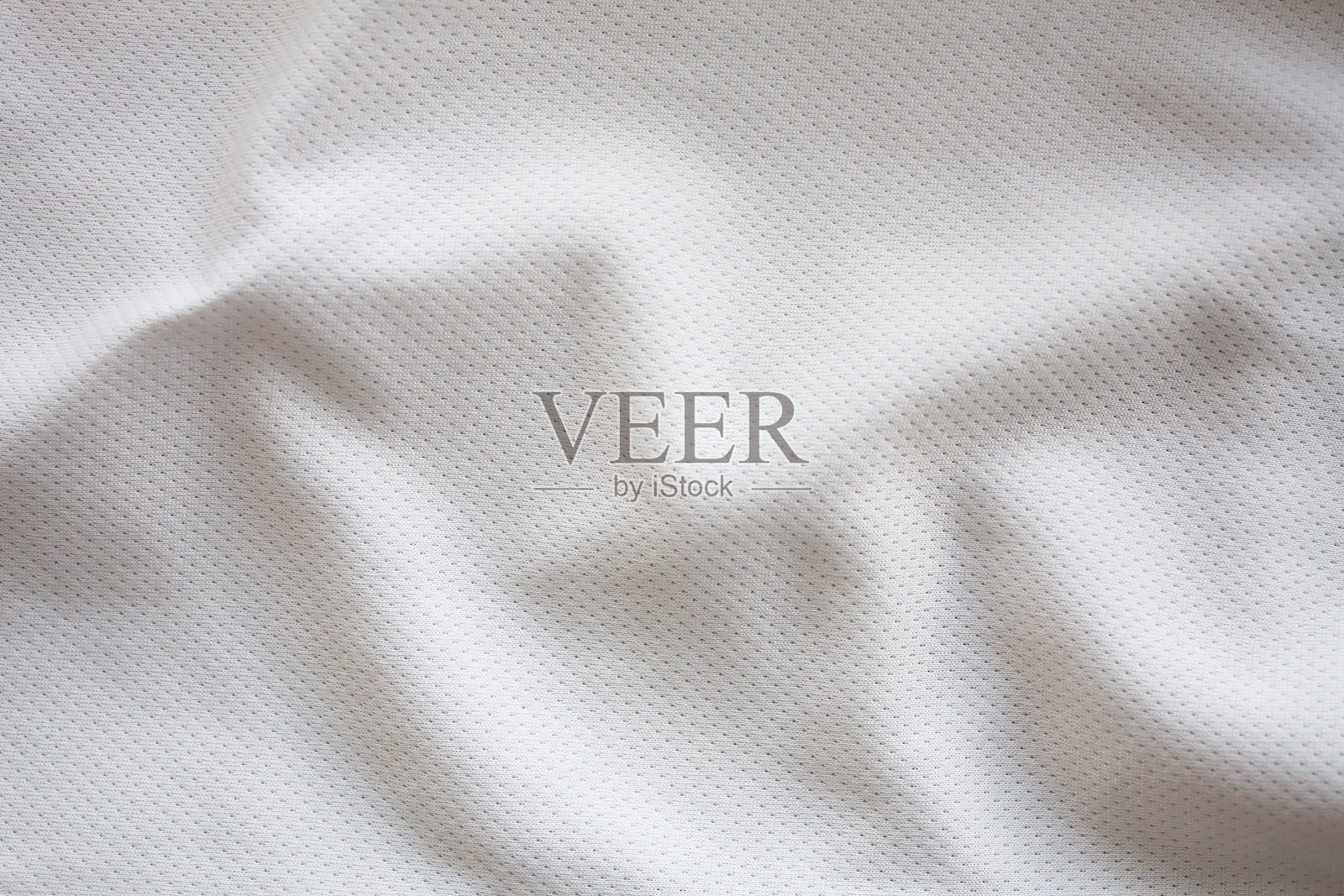 近距离拍摄的白色纹理足球球衣照片摄影图片