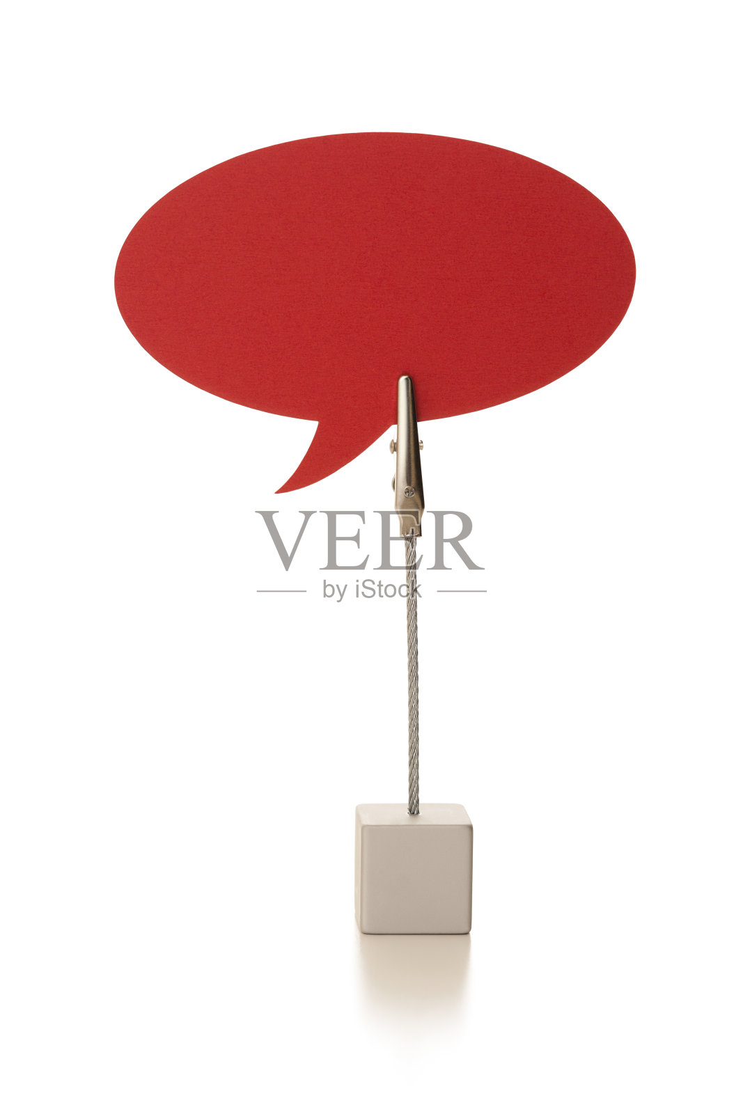 用钢丝钳夹住红色椭圆语音泡照片摄影图片