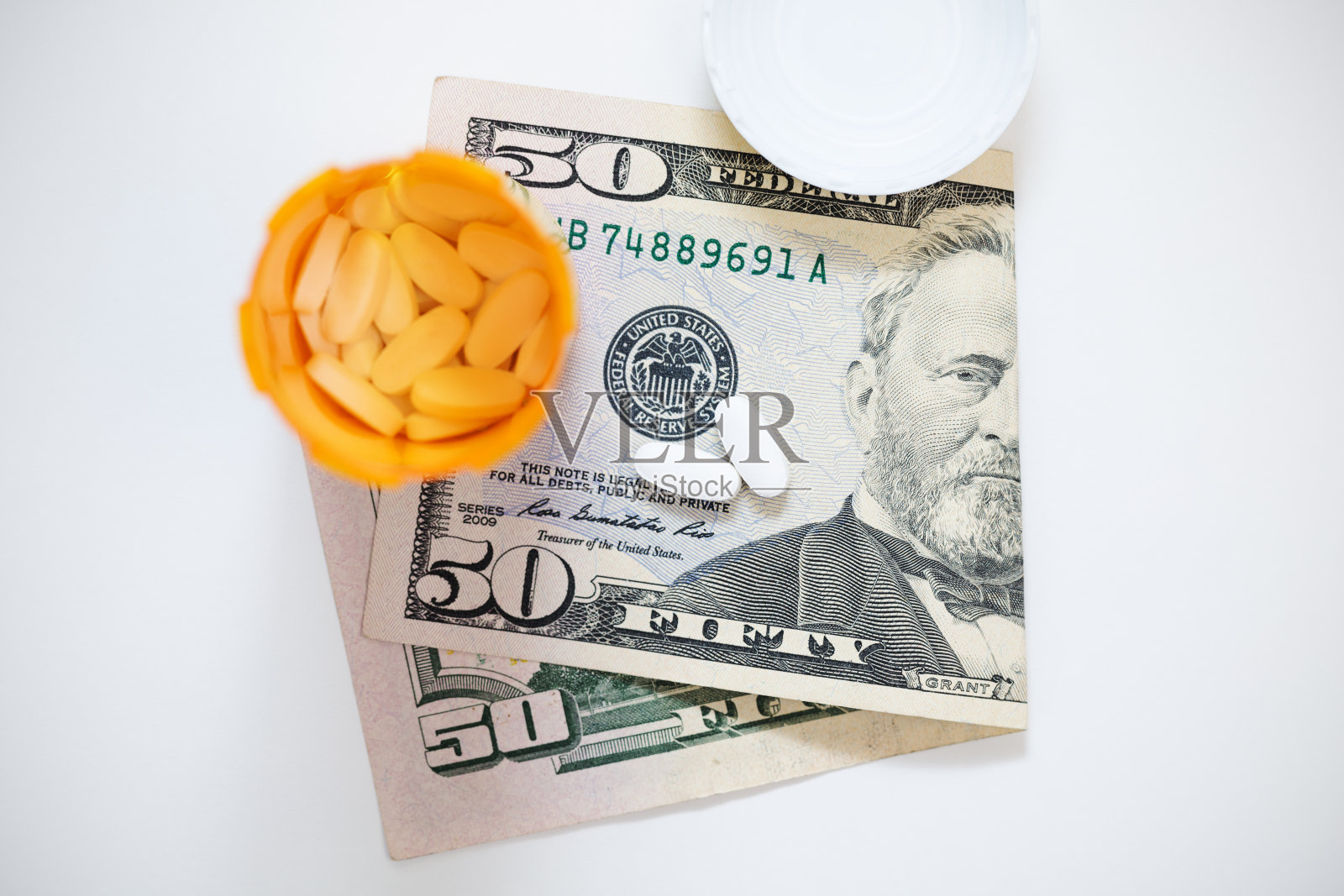 处方药与美元货币照片摄影图片