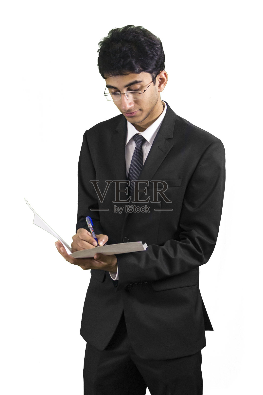 年轻的商人在纸上写字照片摄影图片