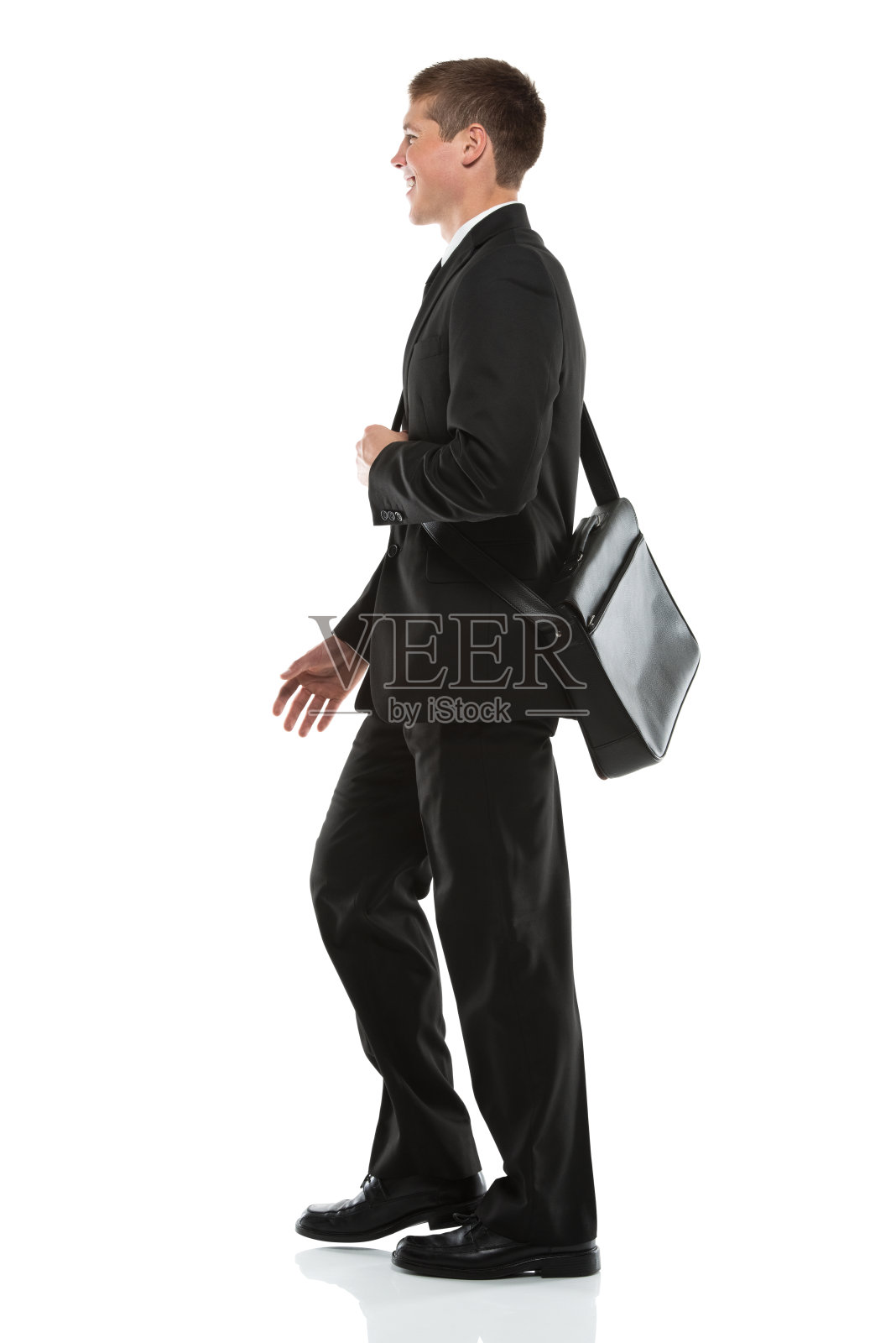 一个商人的侧面站在肩袋照片摄影图片