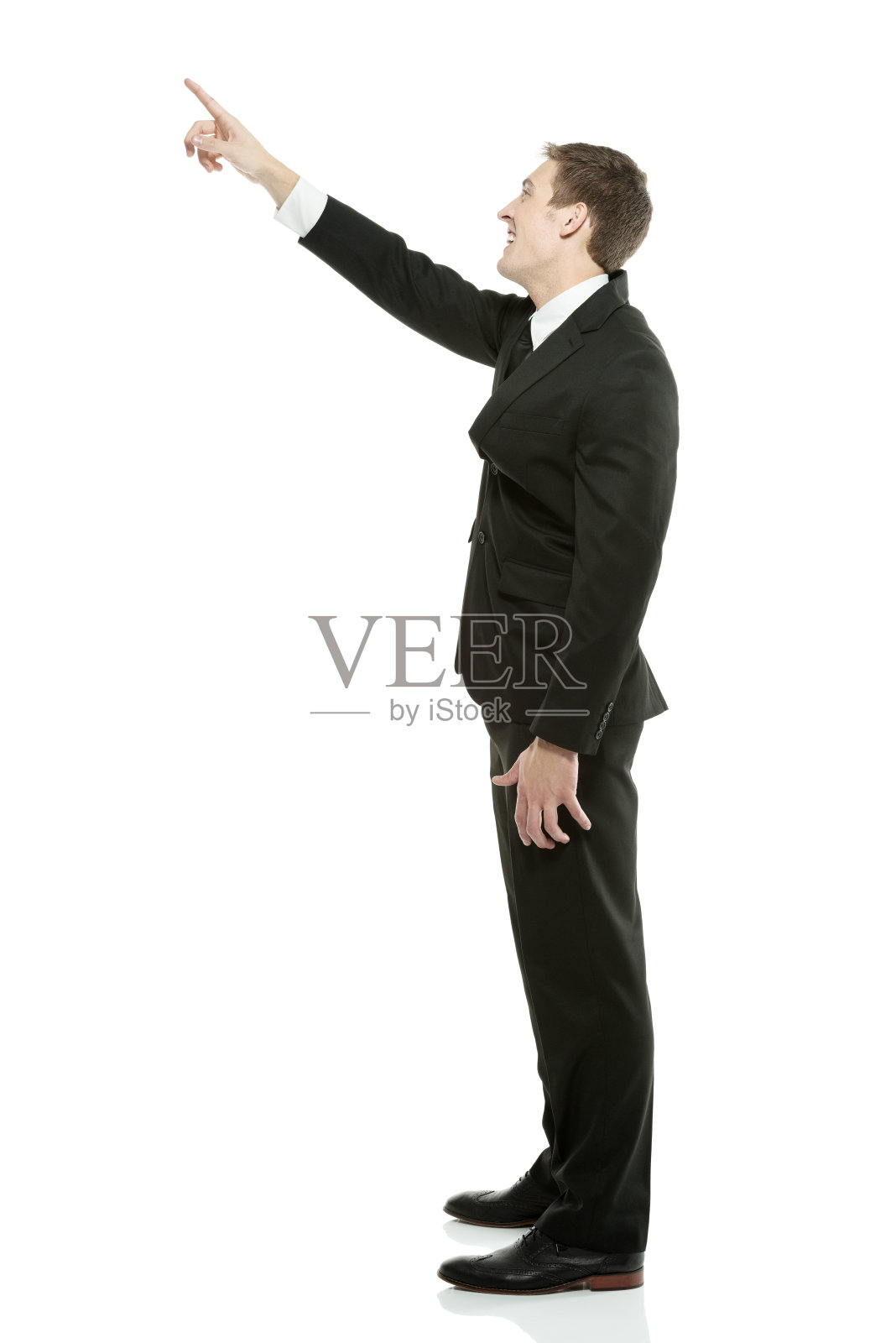 商人用手指指着别处照片摄影图片