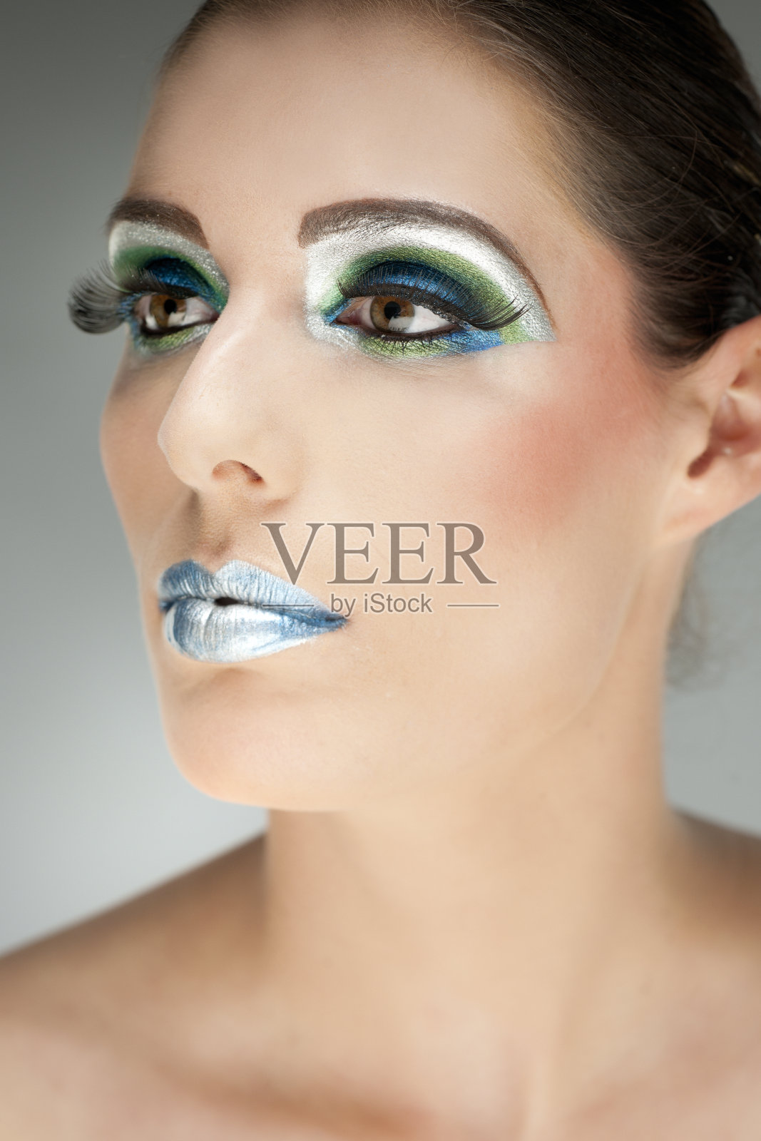 近距离的脸与多色的化妆照片摄影图片