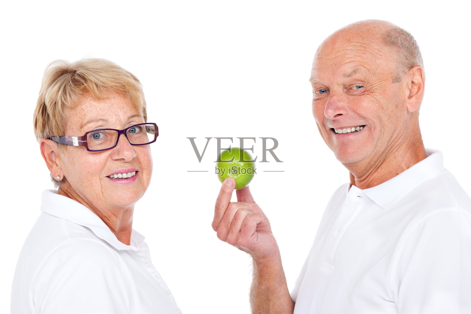 拿着一个健康的苹果照片摄影图片