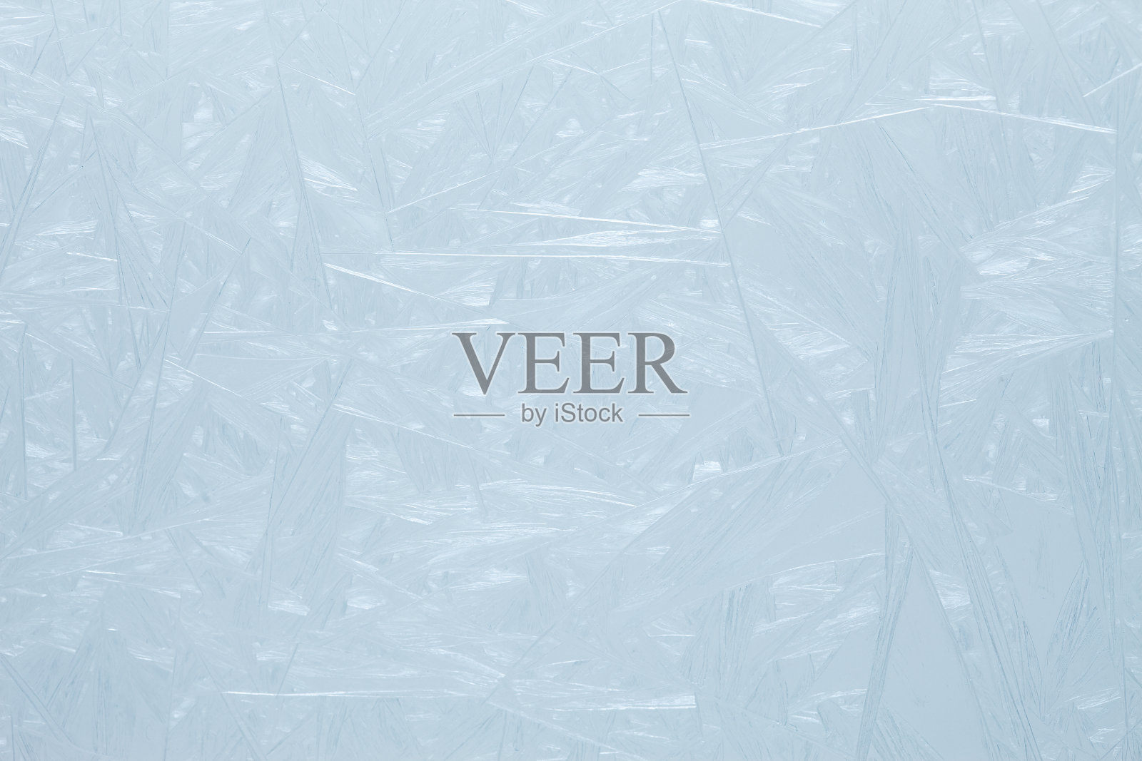 玻璃上有霜冻的图案。照片摄影图片