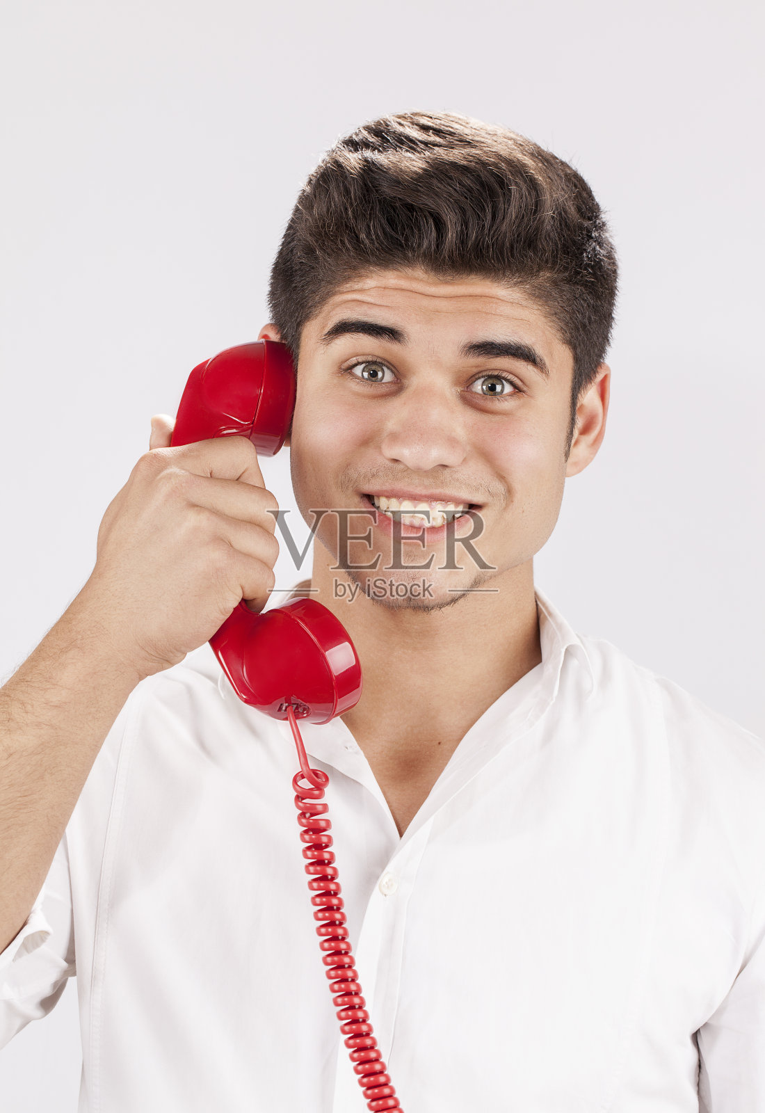 拥有老式手机的快乐男人照片摄影图片