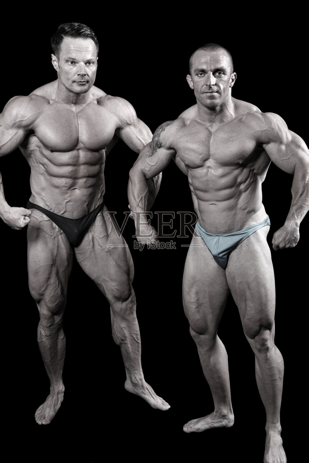 两个健美运动员的姿势照片摄影图片