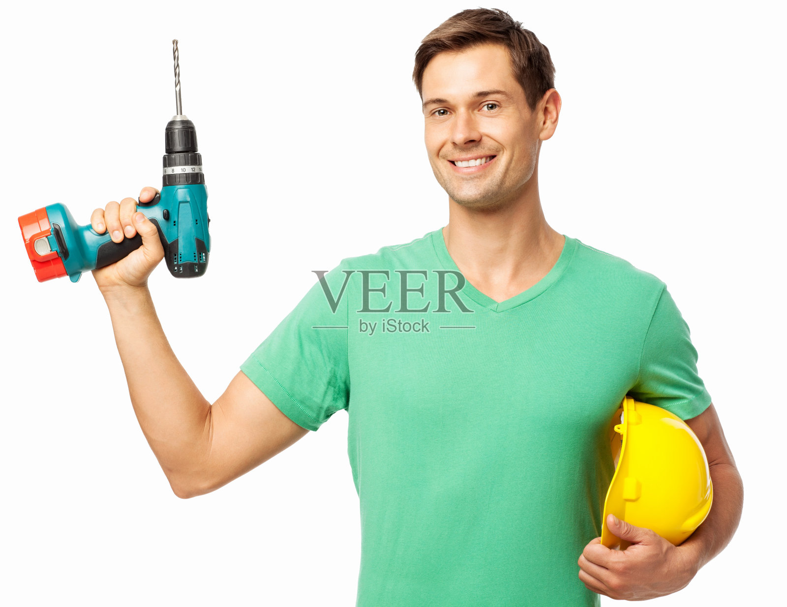 手持钻机和安全帽的年轻木匠照片摄影图片