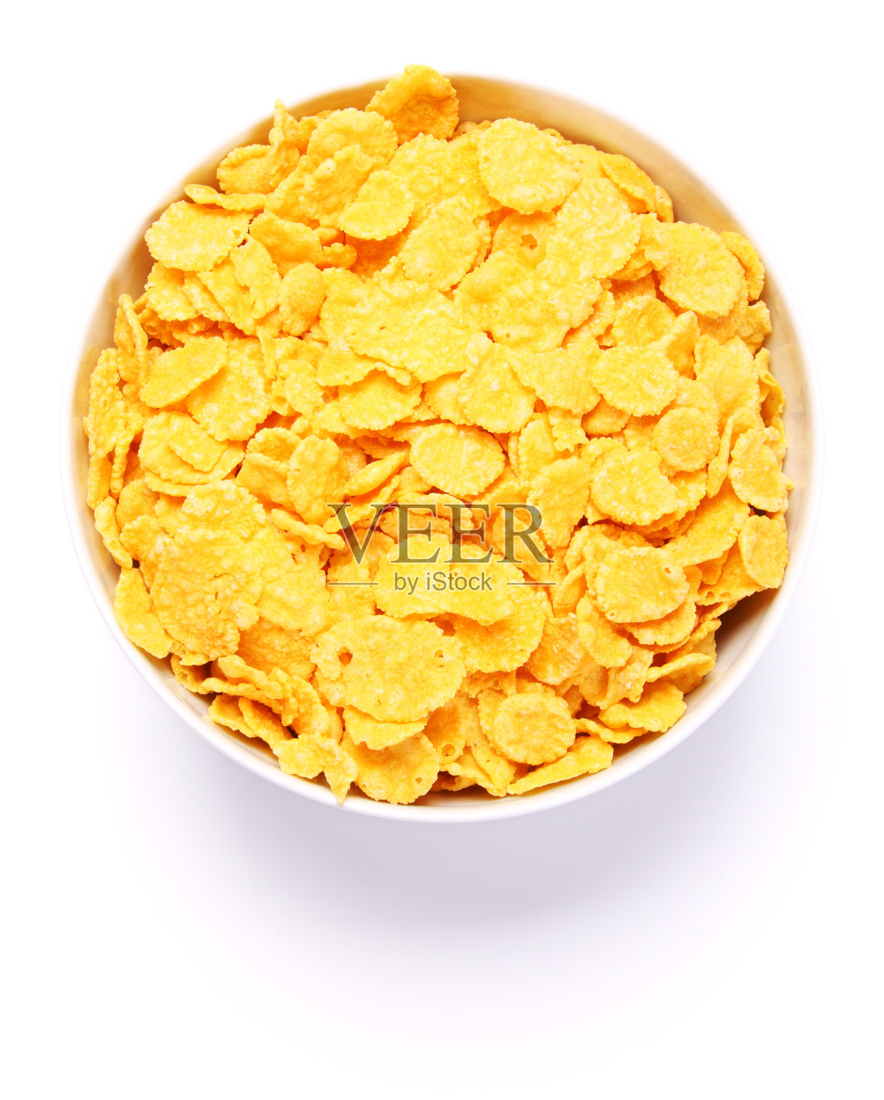 一碗白色背景的玉米片。俯视图照片摄影图片