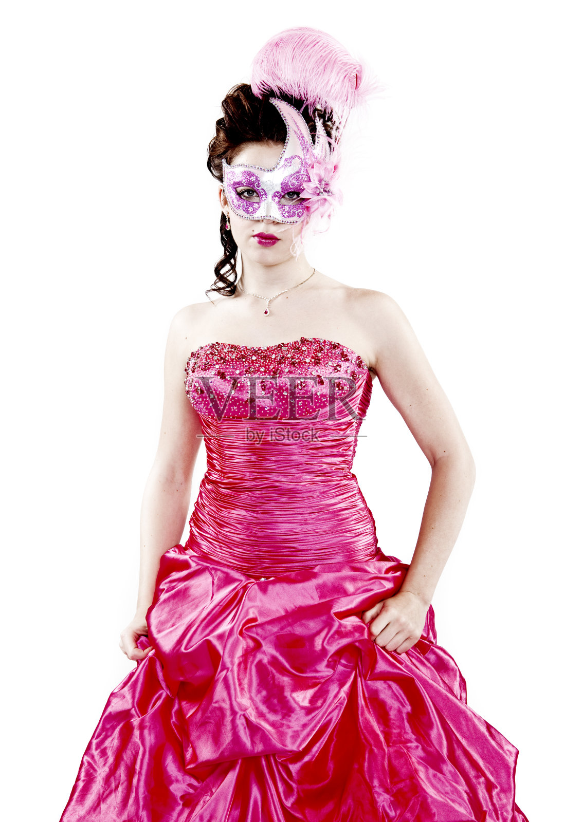 穿粉红衣服的女人和狂欢节面具照片摄影图片