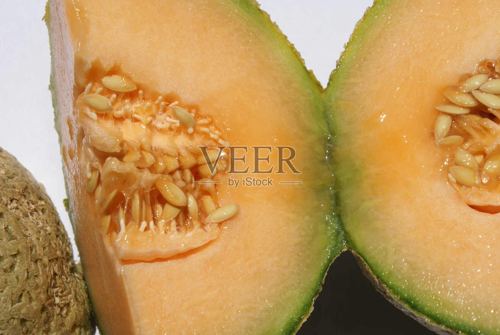 哈密瓜在白色的背景上照片摄影图片