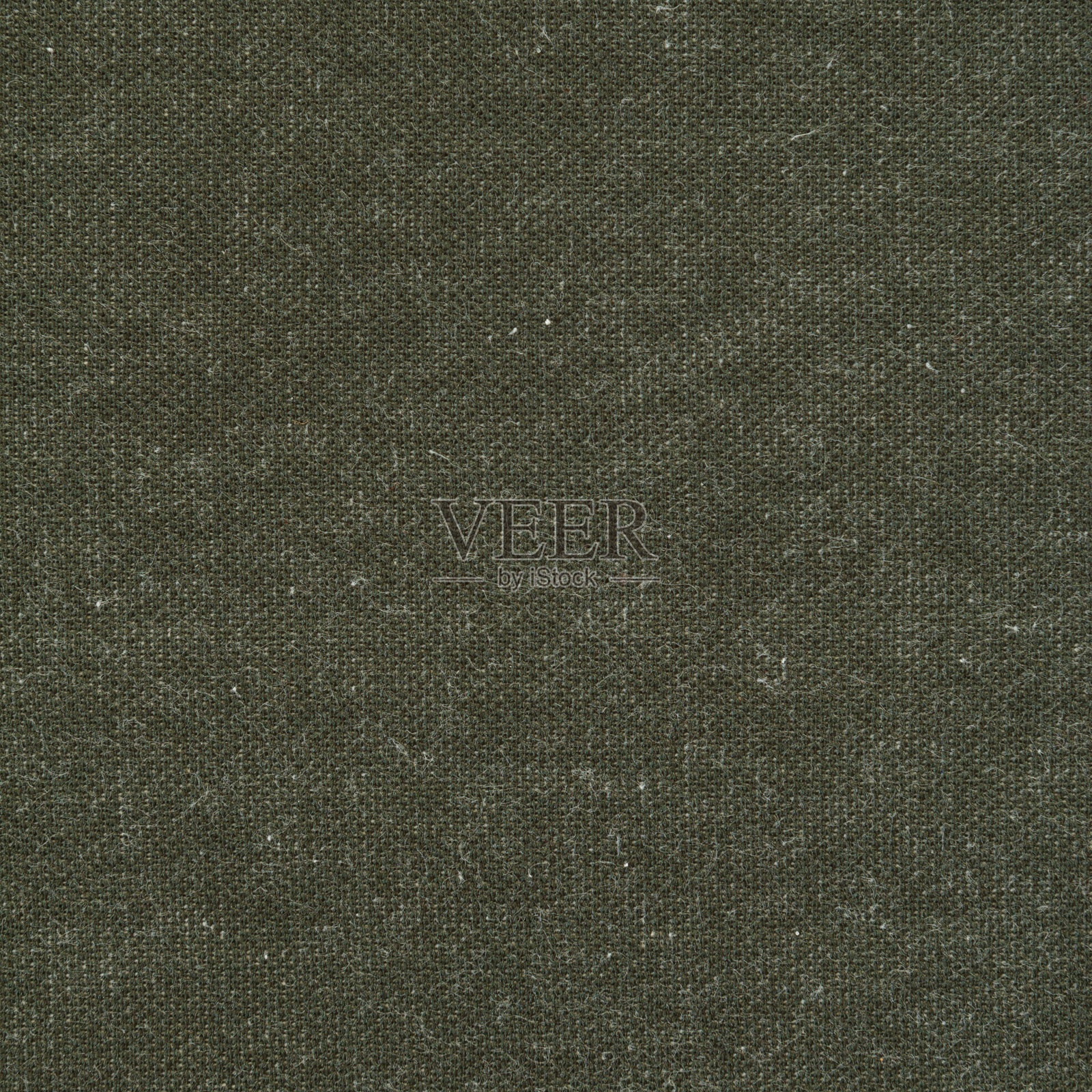 深灰色绿色羊毛针织织物的纹理。照片摄影图片