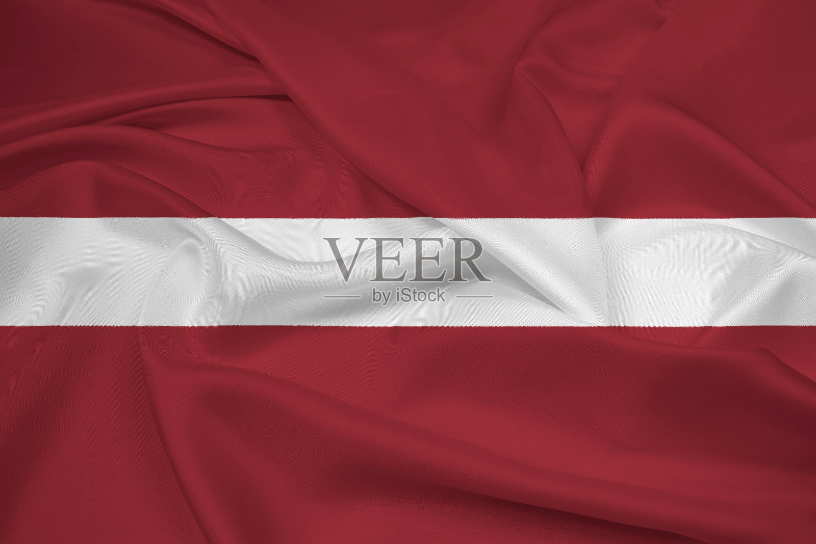 拉脱维亚挥舞着国旗照片摄影图片