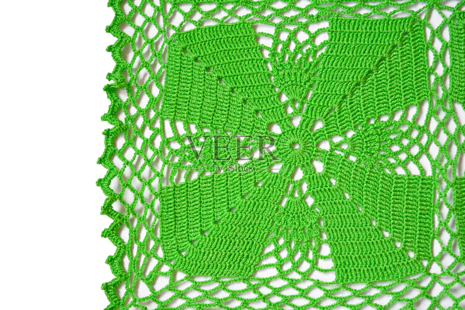 复古手工绿色钩针图案在白色的背景照片摄影图片