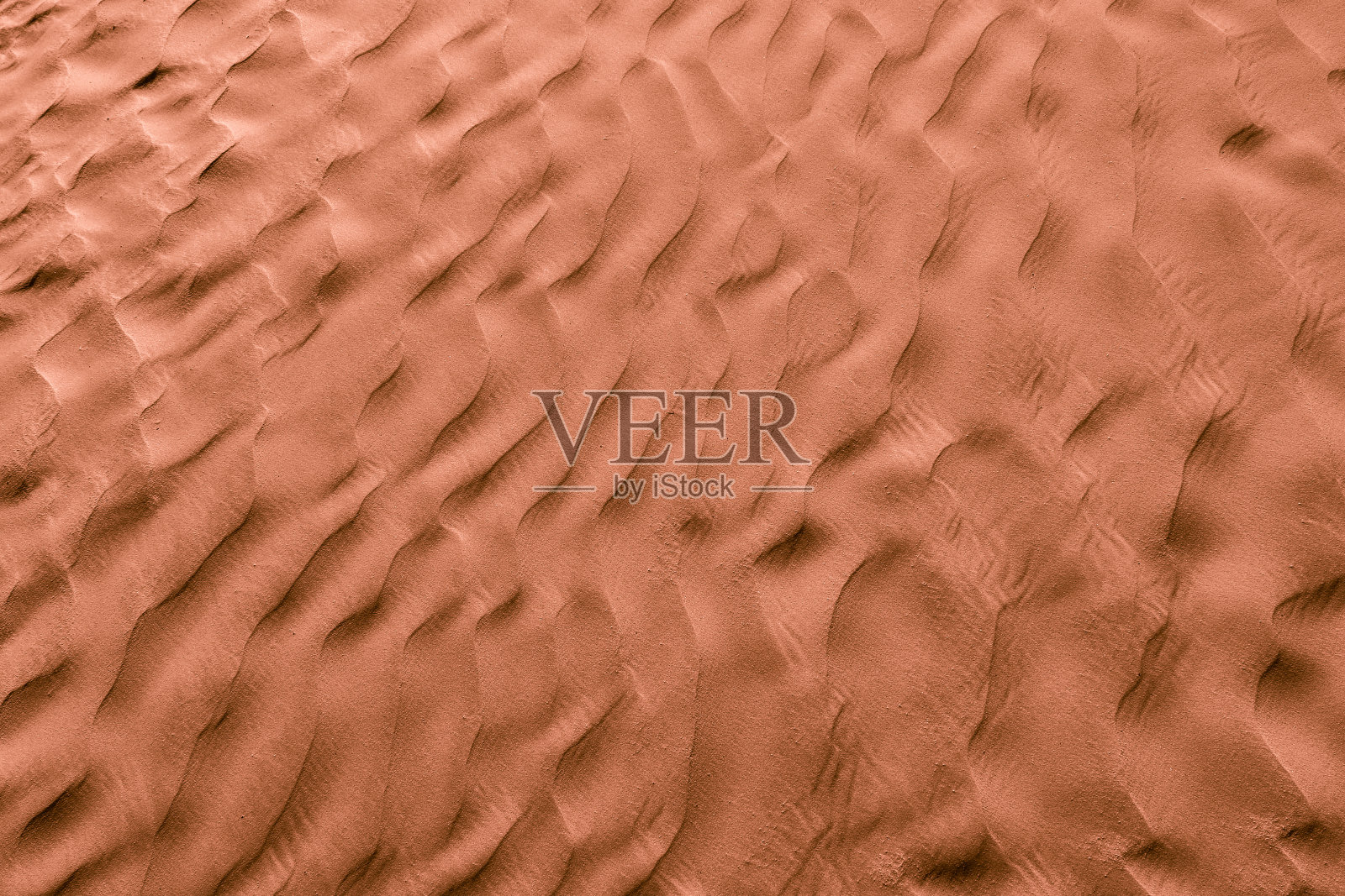 巧克力色的沙漠沙子。背景和纹理照片摄影图片