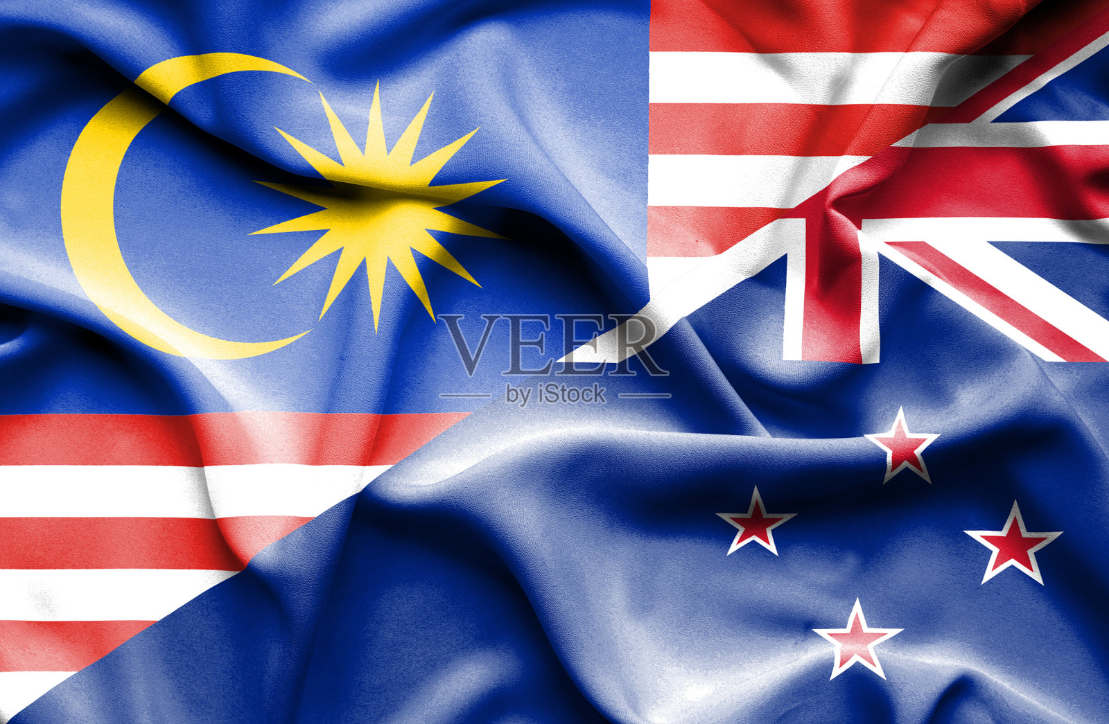 飘扬着新西兰和马来西亚的国旗照片摄影图片